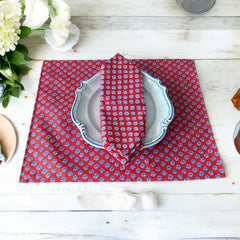 Provence cotton napkins featuring a red background with blue floral designs from the Le Cluny Olives Mimosa French Country Collection, made of 100% cotton, measuring 18" x 18", with vibrant, fade-resistant prints.