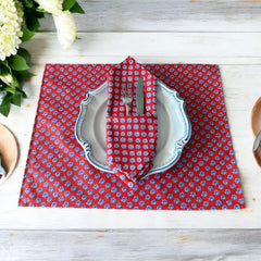 Provence cotton napkins featuring a red background with blue floral designs from the Le Cluny Olives Mimosa French Country Collection, made of 100% cotton, measuring 18" x 18", with vibrant, fade-resistant prints.