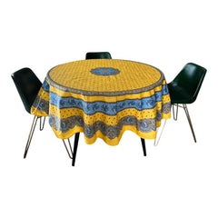 Round Provence-style coated cotton tablecloth by Marat d'Avignon, featuring a vibrant yellow background with blue and white floral patterns. Measures 70 inches in diameter, perfect for indoor and outdoor use, and easy to clean.
