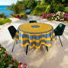 Round Provence-style coated cotton tablecloth by Marat d'Avignon, featuring a vibrant yellow background with blue and white floral patterns. Measures 70 inches in diameter, perfect for indoor and outdoor use, and easy to clean.