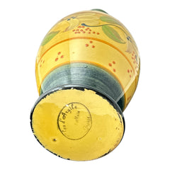 Handmade ceramic oil bottle or vase from Provence, featuring a yellow glaze with green accents and hand-painted white floral motif, signed Bleu d’Argile France