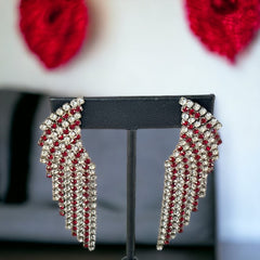Vintage 1980s sparkly earrings with red and clear prong-set rhinestones, silver tone metal, waterfall drop design, and posts for pierced ears. High-quality craftsmanship with an elegant and glamorous look, perfect for special events and evening wear.