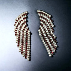 Vintage 1980s sparkly earrings with red and clear prong-set rhinestones, silver tone metal, waterfall drop design, and posts for pierced ears. High-quality craftsmanship with an elegant and glamorous look, perfect for special events and evening wear.