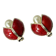 Set of two vintage 1990s ladybug scatter brooches featuring red guilloché enamel wings with a delicate engraved pattern, gold-tone metal, black enamel eyes, and pear-shaped faux pearls nestled between the wings. These whimsical yet elegant brooches add a charming touch to any outfit. Unsigned and in very good vintage condition.