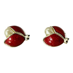 Set of two vintage 1990s ladybug scatter brooches featuring red guilloché enamel wings with a delicate engraved pattern, gold-tone metal, black enamel eyes, and pear-shaped faux pearls nestled between the wings. These whimsical yet elegant brooches add a charming touch to any outfit. Unsigned and in very good vintage condition.
