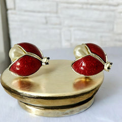 Set of two vintage 1990s ladybug scatter brooches featuring red guilloché enamel wings with a delicate engraved pattern, gold-tone metal, black enamel eyes, and pear-shaped faux pearls nestled between the wings. These whimsical yet elegant brooches add a charming touch to any outfit. Unsigned and in very good vintage condition.