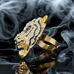Gold-tone adjustable cocktail ring shaped like a tiger’s head, featuring clear rhinestones and black enamel detailing; ornate design with sparkling facial features and bold statement style, sourced in France and in very good condition.