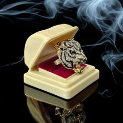 Gold-tone adjustable cocktail ring shaped like a tiger’s head, featuring clear rhinestones and black enamel detailing; ornate design with sparkling facial features and bold statement style, sourced in France and in very good condition.