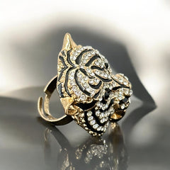 Gold-tone adjustable cocktail ring shaped like a tiger’s head, featuring clear rhinestones and black enamel detailing; ornate design with sparkling facial features and bold statement style, sourced in France and in very good condition.