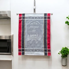 Provence tea towel featuring Châteauneuf-du-Pape winery chateau design with gray background and red and brown striped borders. Made of 100% cotton, ideal for wine-inspired kitchen decor and rustic elegance.