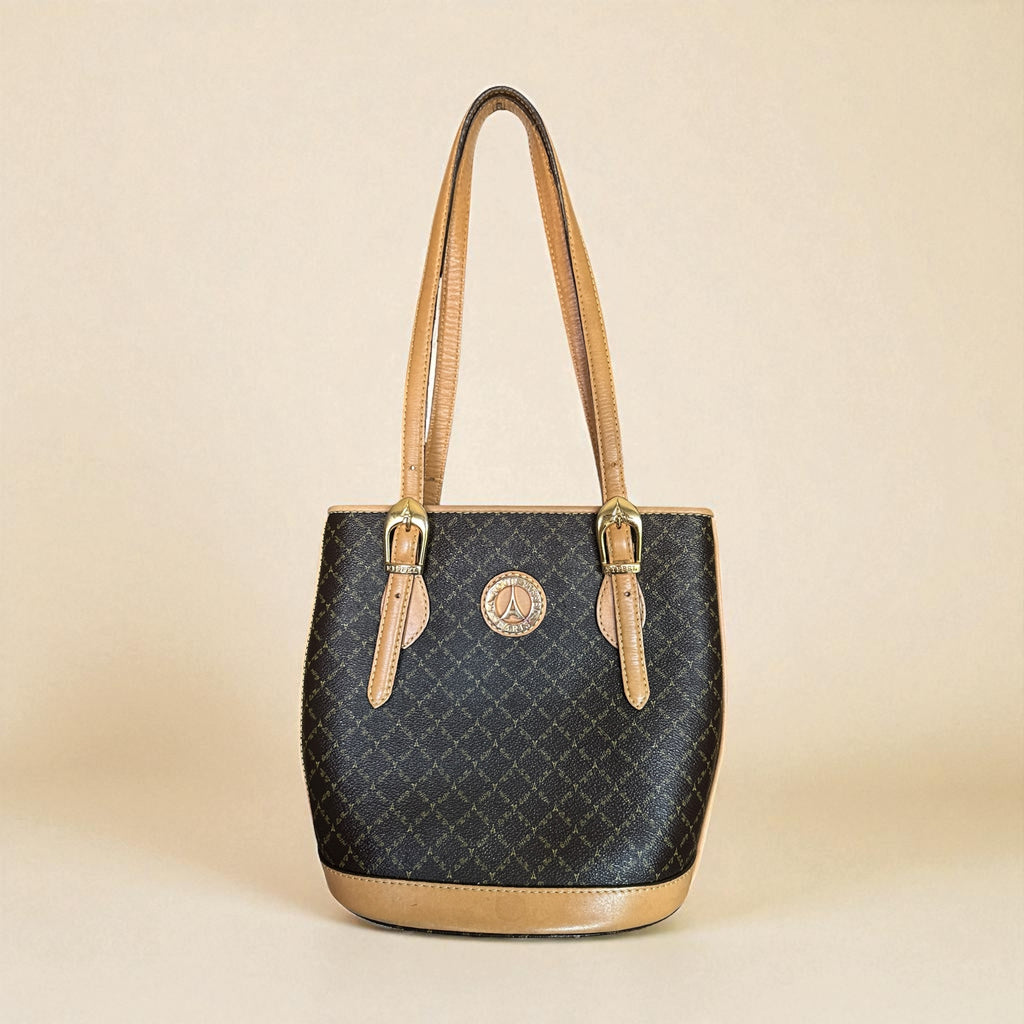 Preloved La Tour Eiffel Paris 1887 brown and tan leather shoulder bag with gold-tone hardware, adjustable handles, and signature logo detailing—elegant bucket silhouette.