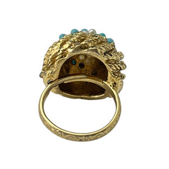 Vintage gold-tone dome cocktail ring featuring faux turquoise, peridot rhinestones, and faux seed pearls with a textured shank. Adjustable on one side and estimated from the 1990s, in good vintage condition.