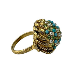 Vintage gold-tone dome cocktail ring featuring faux turquoise, peridot rhinestones, and faux seed pearls with a textured shank. Adjustable on one side and estimated from the 1990s, in good vintage condition.