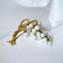 Vintage milk glass brooch featuring three single beads and a grape cluster hanging from textured gold-tone branches, possibly unsigned Marvella from the 1970s/80s, in very good condition with a whimsical and elegant design.