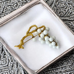 Vintage milk glass brooch featuring three single beads and a grape cluster hanging from textured gold-tone branches, possibly unsigned Marvella from the 1970s/80s, in very good condition with a whimsical and elegant design.
