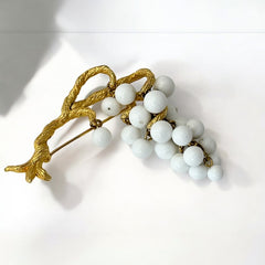 Vintage milk glass brooch featuring three single beads and a grape cluster hanging from textured gold-tone branches, possibly unsigned Marvella from the 1970s/80s, in very good condition with a whimsical and elegant design.