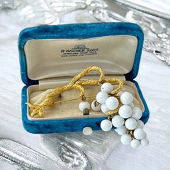 Vintage milk glass brooch featuring three single beads and a grape cluster hanging from textured gold-tone branches, possibly unsigned Marvella from the 1970s/80s, in very good condition with a whimsical and elegant design.