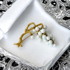 Vintage milk glass brooch featuring three single beads and a grape cluster hanging from textured gold-tone branches, possibly unsigned Marvella from the 1970s/80s, in very good condition with a whimsical and elegant design.