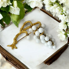 Vintage milk glass brooch featuring three single beads and a grape cluster hanging from textured gold-tone branches, possibly unsigned Marvella from the 1970s/80s, in very good condition with a whimsical and elegant design.