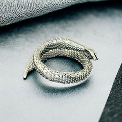 Vintage Whiting & Davis silver-tone mesh snake wrap bracelet with sculpted serpent head and tail, coiled design, adjustable fit, and detailed scale texture—symbolic of transformation and eternity.