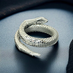 Vintage Whiting & Davis silver-tone mesh snake wrap bracelet with sculpted serpent head and tail, coiled design, adjustable fit, and detailed scale texture—symbolic of transformation and eternity.