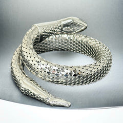Vintage Whiting & Davis silver-tone mesh snake wrap bracelet with sculpted serpent head and tail, coiled design, adjustable fit, and detailed scale texture—symbolic of transformation and eternity.