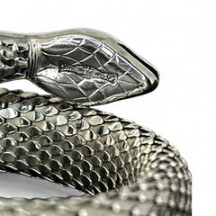 Vintage Whiting & Davis silver-tone mesh snake wrap bracelet with sculpted serpent head and tail, coiled design, adjustable fit, and detailed scale texture—symbolic of transformation and eternity.