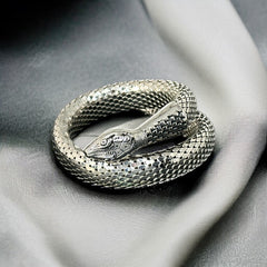 Vintage Whiting & Davis silver-tone mesh snake wrap bracelet with sculpted serpent head and tail, coiled design, adjustable fit, and detailed scale texture—symbolic of transformation and eternity.