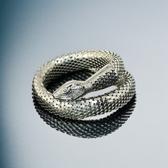 Vintage Whiting & Davis silver-tone mesh snake wrap bracelet with sculpted serpent head and tail, coiled design, adjustable fit, and detailed scale texture—symbolic of transformation and eternity.