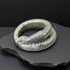 Vintage Whiting & Davis silver-tone mesh snake wrap bracelet with sculpted serpent head and tail, coiled design, adjustable fit, and detailed scale texture—symbolic of transformation and eternity.