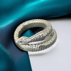 Vintage Whiting & Davis silver-tone mesh snake wrap bracelet with sculpted serpent head and tail, coiled design, adjustable fit, and detailed scale texture—symbolic of transformation and eternity.