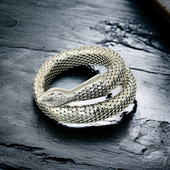 Vintage Whiting & Davis silver-tone mesh snake wrap bracelet with sculpted serpent head and tail, coiled design, adjustable fit, and detailed scale texture—symbolic of transformation and eternity.