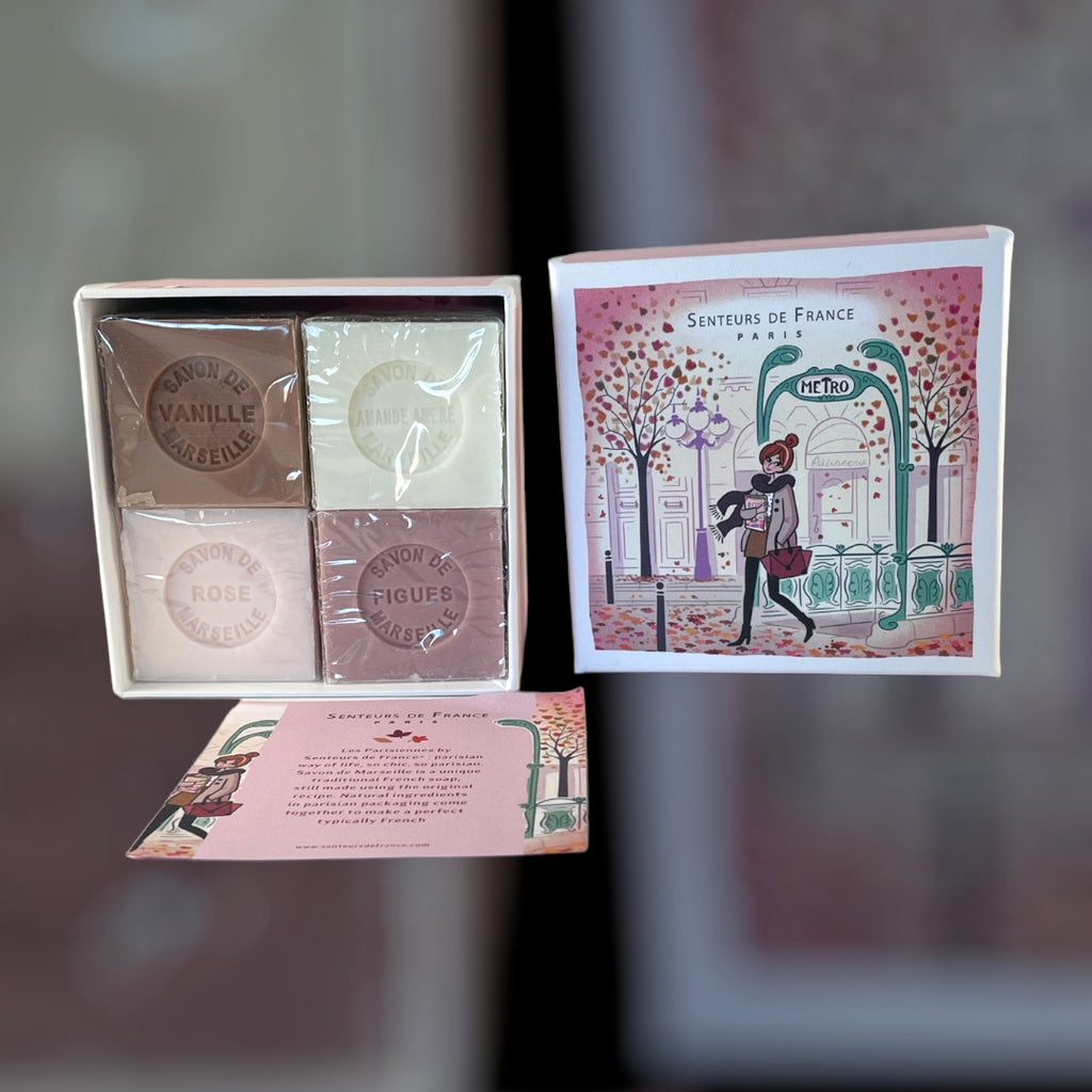 Paris Metro-themed gift box featuring an iconic design, containing four artisanal Marseille cube soaps in Rose, Vanilla, Fig, and Almond fragrances.