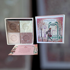 Paris Metro-themed gift box featuring an iconic design, containing four artisanal Marseille cube soaps in Rose, Vanilla, Fig, and Almond fragrances.