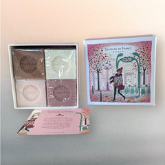 Paris Metro-themed gift box featuring an iconic design, containing four artisanal Marseille cube soaps in Rose, Vanilla, Fig, and Almond fragrances.