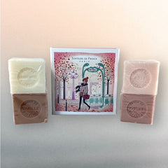 Paris Metro-themed gift box featuring an iconic design, containing four artisanal Marseille cube soaps in Rose, Vanilla, Fig, and Almond fragrances.