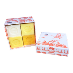 Orange Toile de Jouy gift box with vibrant patterns, containing four artisanal Marseille cube soaps in Honeysuckle, Mimosa, Orange-Grapefruit, and Jasmine fragrances.