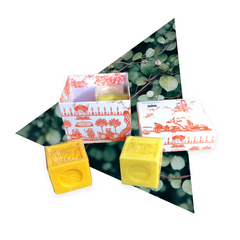 Orange Toile de Jouy gift box with vibrant patterns, containing four artisanal Marseille cube soaps in Honeysuckle, Mimosa, Orange-Grapefruit, and Jasmine fragrances.