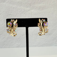 Vintage light gold‑tone floral clip‑on earrings with AB topaz rhinestones in a mid‑century design.