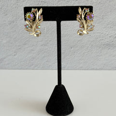 Vintage light gold‑tone floral clip‑on earrings with AB topaz rhinestones in a mid‑century design.