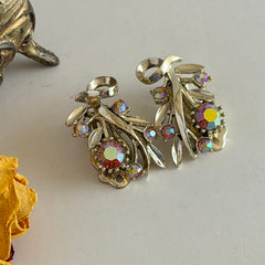 Vintage light gold‑tone floral clip‑on earrings with AB topaz rhinestones in a mid‑century design.