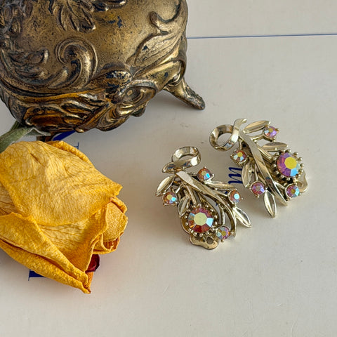 Vintage light gold‑tone floral clip‑on earrings with AB topaz rhinestones in a mid‑century design.