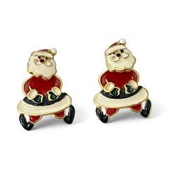 Vintage AIM Santa earrings with red, white, and black enamel, signed with copyright mark, featuring movable head and pierced stud design.