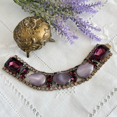 Vintage 1950s bracelet with lavender satin glass cabochons and amethyst rhinestones in prong‑set silver‑tone settings.