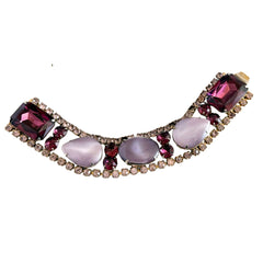 Vintage 1950s bracelet with lavender satin glass cabochons and amethyst rhinestones in prong‑set silver‑tone settings.