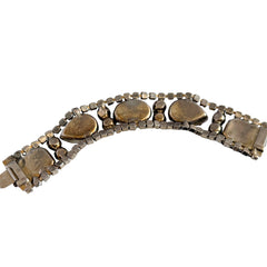 Vintage 1950s bracelet with lavender satin glass cabochons and amethyst rhinestones in prong‑set silver‑tone settings.