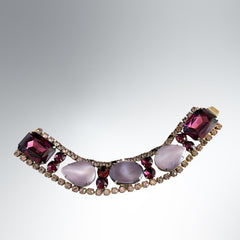 Vintage 1950s bracelet with lavender satin glass cabochons and amethyst rhinestones in prong‑set silver‑tone settings.
