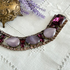 Vintage 1950s bracelet with lavender satin glass cabochons and amethyst rhinestones in prong‑set silver‑tone settings.