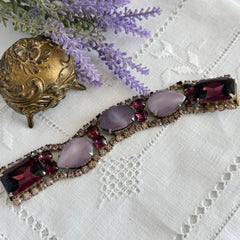 Vintage 1950s bracelet with lavender satin glass cabochons and amethyst rhinestones in prong‑set silver‑tone settings.
