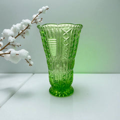 Vintage spring green pressed glass vase with scalloped rim and embossed geometric patterns, shown from various angles to highlight texture and translucence.